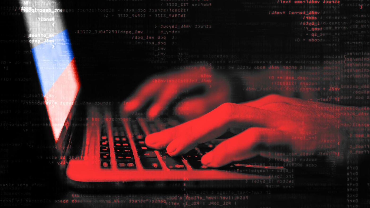 Hands typing on a laptop.