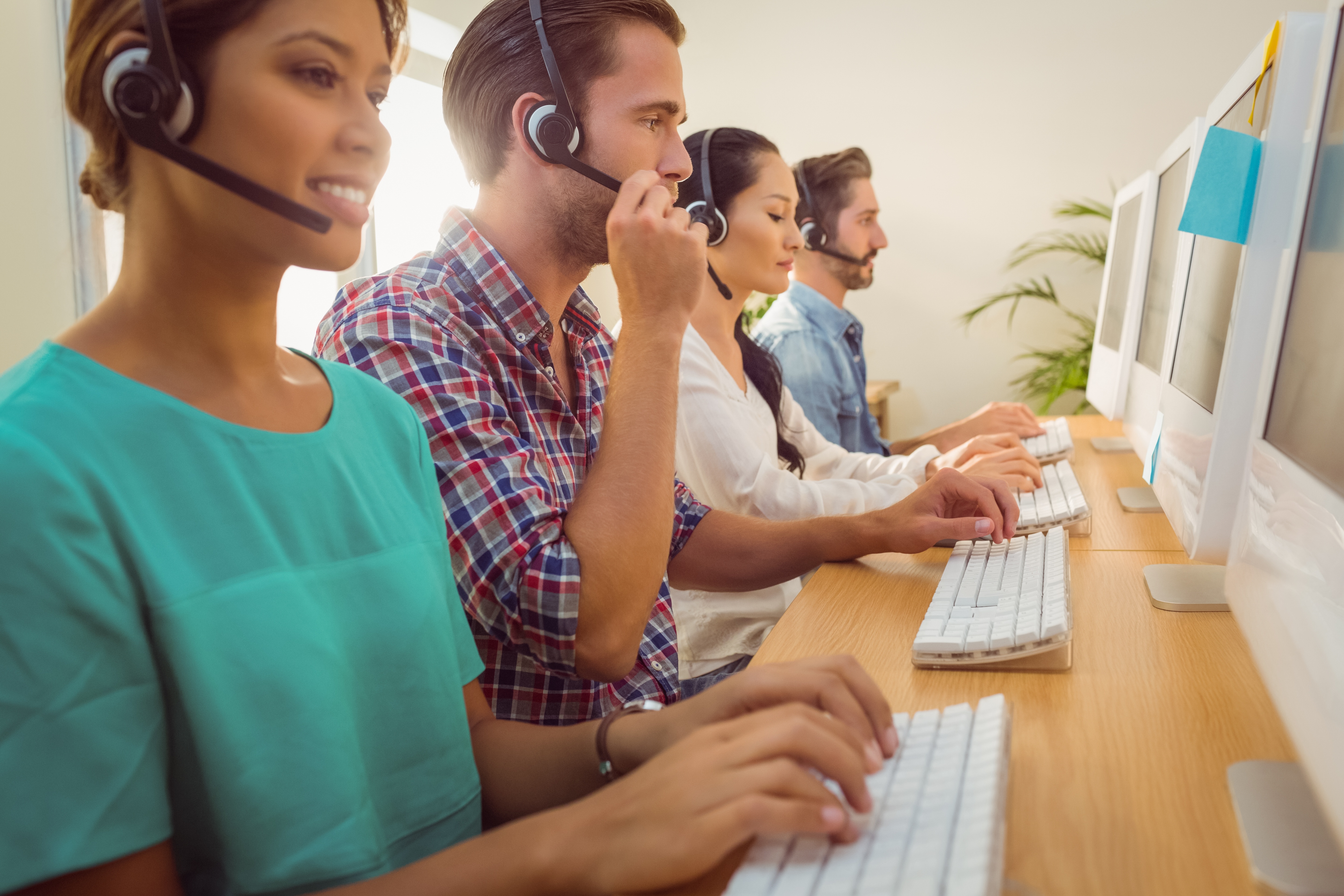 Contact center agent team working at their stations