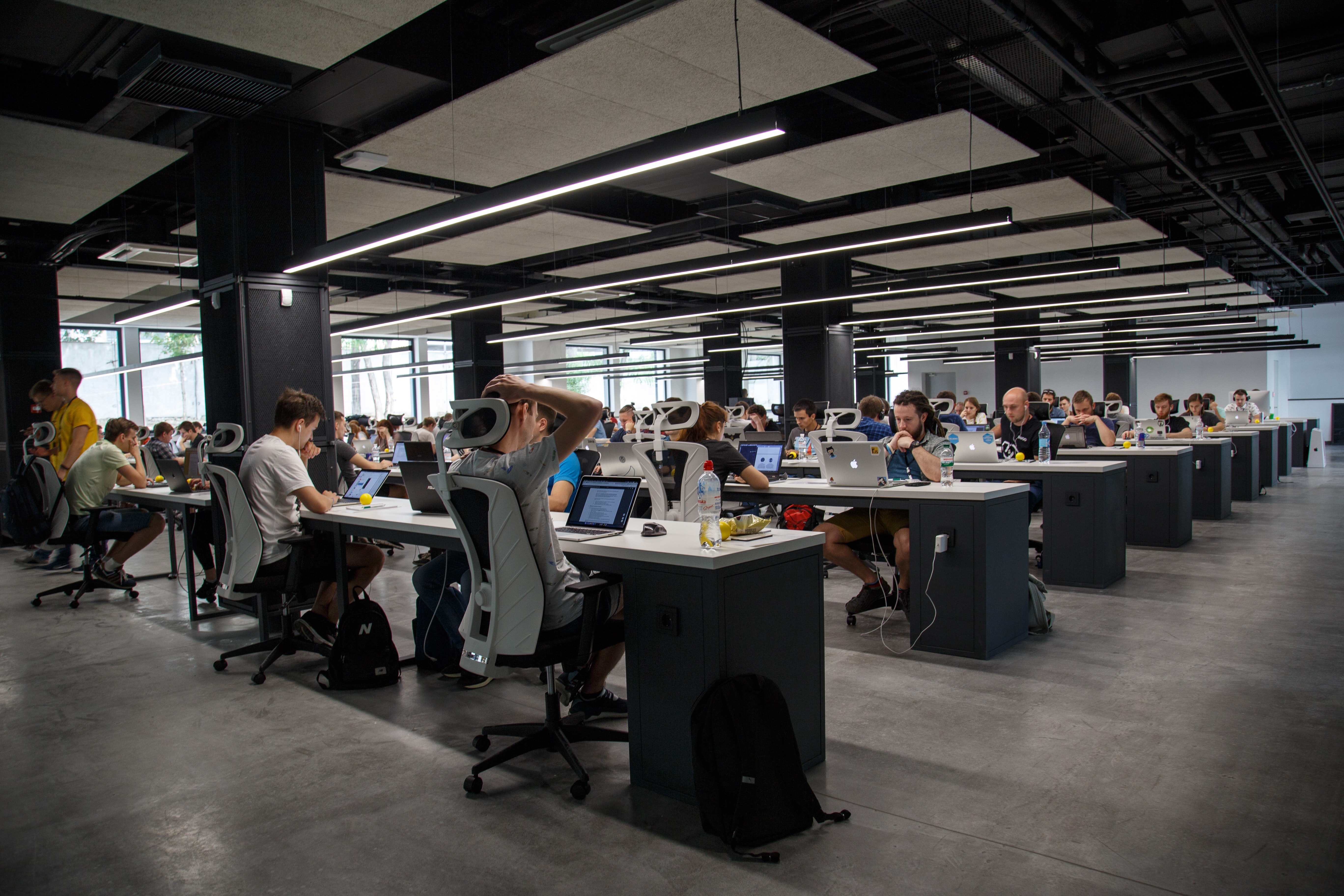 CCaaS agents at their desks. Photo by Alex Kotliarskyi